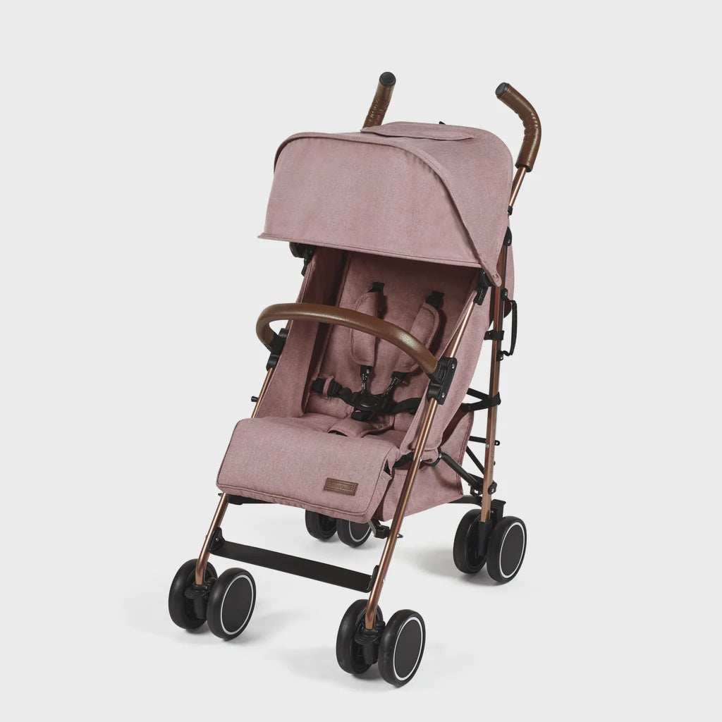 Ickle Bubba Discovery stroller in dusky pink with rose gold frame, blush pink fabric, black wheels, and brown leather handles