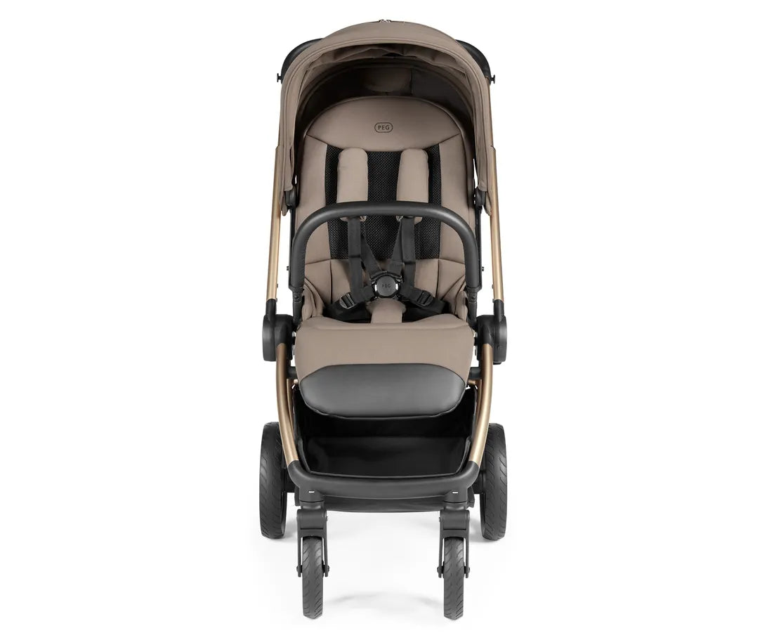 Beige and black peg perego city loop pro stroller with gold-tone frame showing the back side in pine bark color