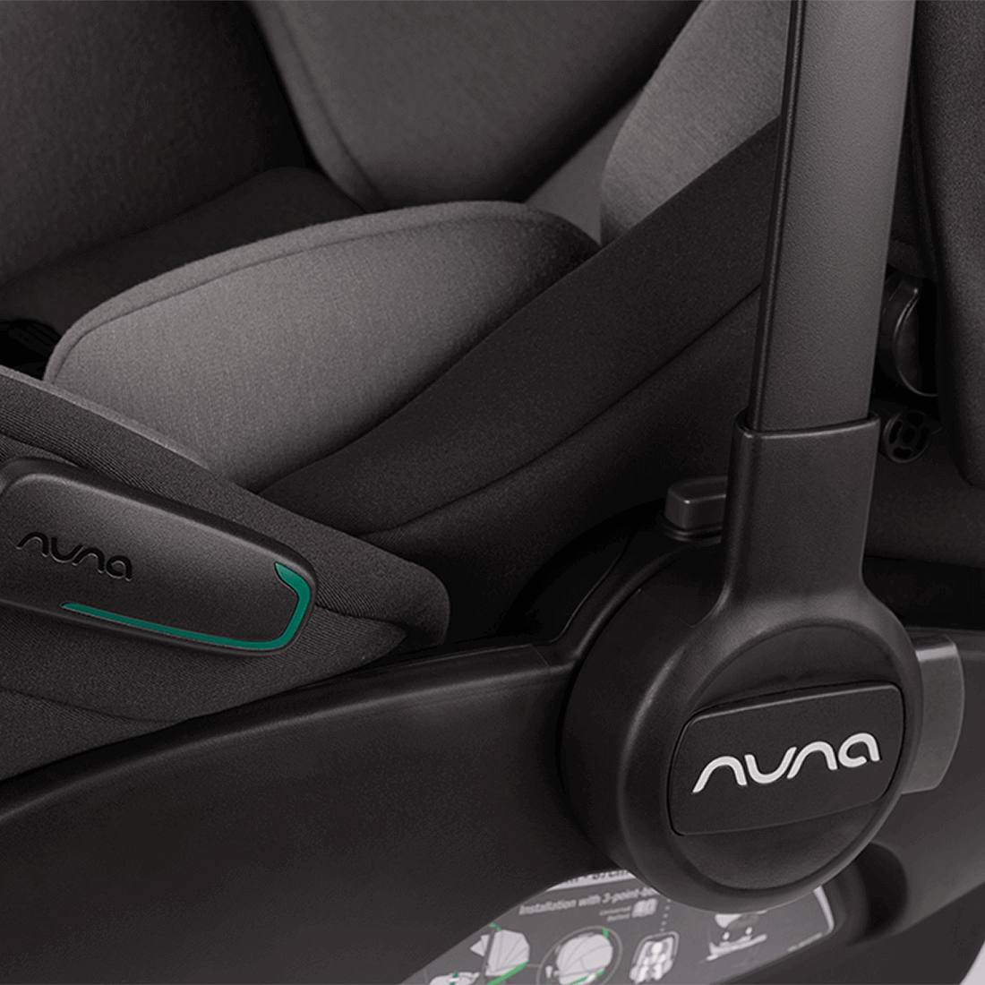 Black nuna arra flex infant car seat with gray fabric upholstery and teal accent line for flat recline i-size use
