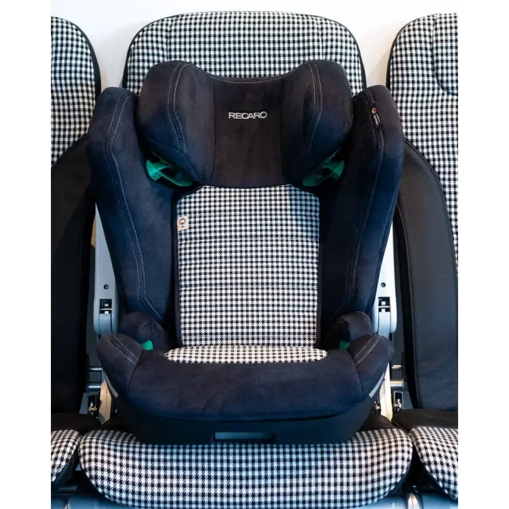 Recaro AXION 1 Pepita on a vehicle seat with matching black-and-white houndstooth upholstery.