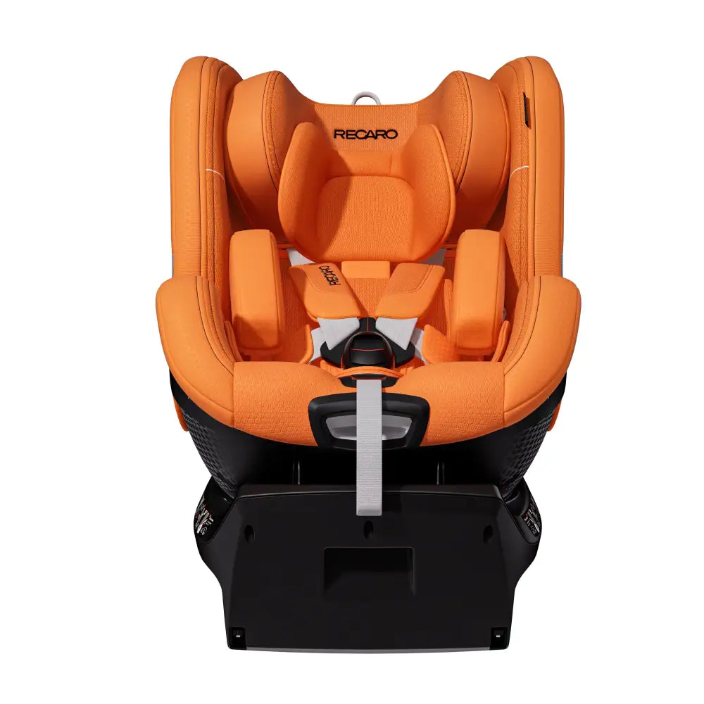 Recaro TORON 1 in Vibrant Orange, front view with padded insert, shoulder harness, buckle and grey adjustment strap.