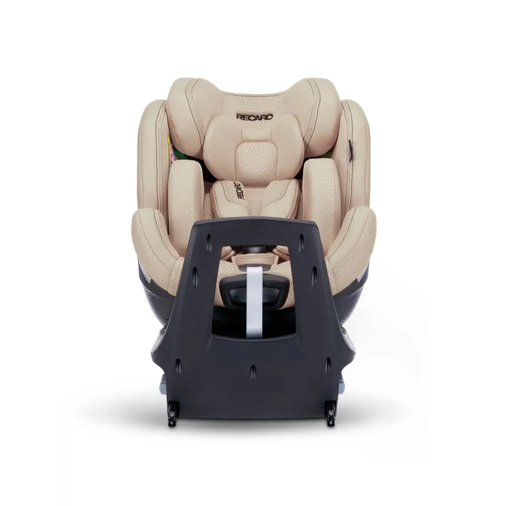 Elegant Beige XENON 1 with padded insert and harness, viewed across the tall black panel at the end of its base.