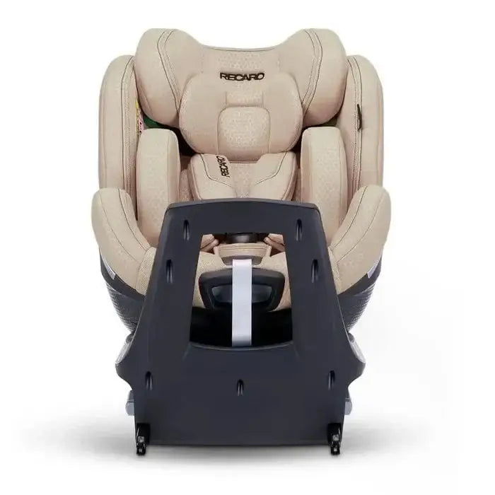 Elegant Beige XENON 1 KID, rear view showing the ventilation panel, silver side trim and extended support leg.