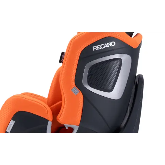 Close-up of the Vibrant Orange XENON 1 KID’s black side shell, silver trim and Recaro logo.