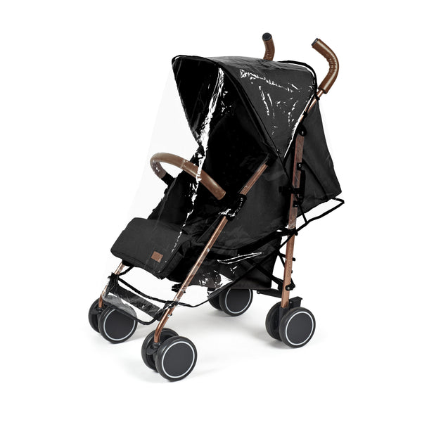 Ickle Bubba Discovery stroller in black with rose gold metallic frame and transparent rain cover shown from the back side