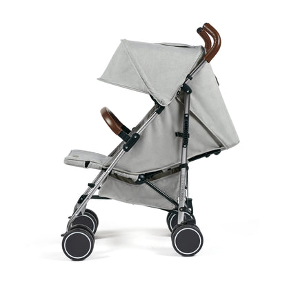 Ickle Bubba Discovery stroller in grey with brown leather handles and black wheels shown from the back side