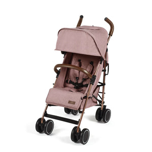 Ickle Bubba Discovery stroller in dusky pink with rose gold frame, blush pink fabric, brown leather handles, and black wheels