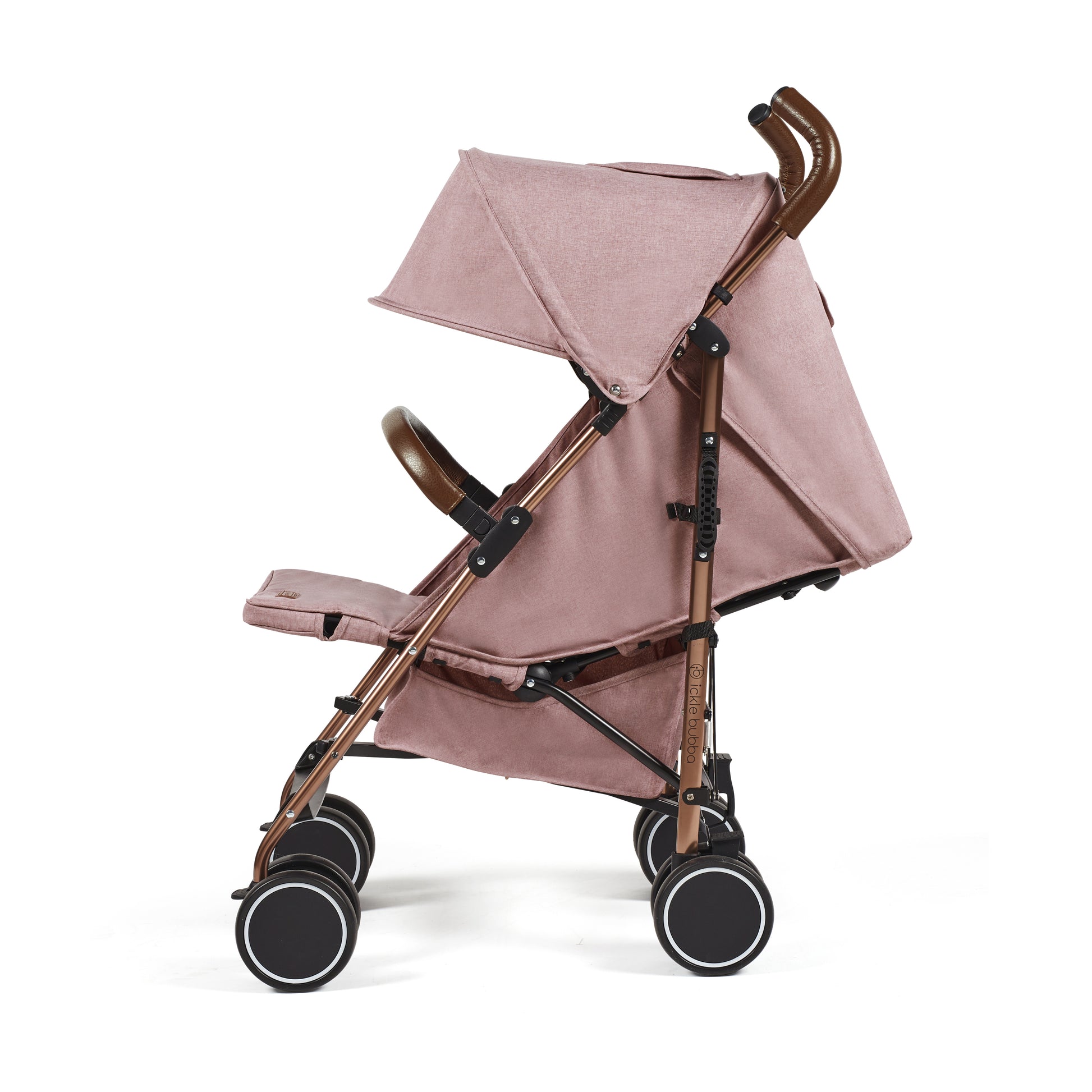 Ickle Bubba Discovery stroller in dusky pink features a rose gold frame, blush pink canopy, brown leather-like handles, and black wheels