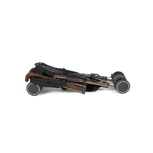 Folded ickle bubba discovery max stroller with sleek bronze frame black fabric and four sturdy wheels