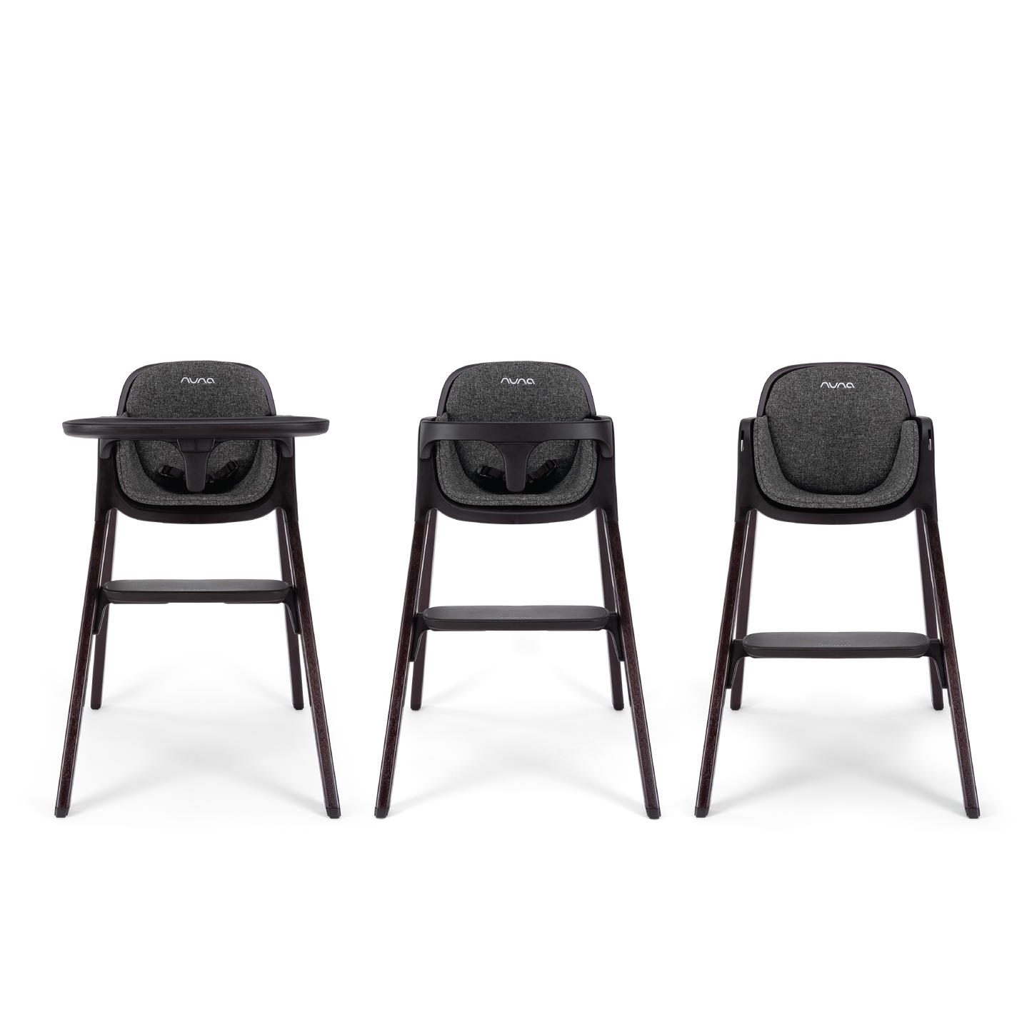 Three nuna bryn highchairs with dark gray fabric seats and sleek wooden legs shown from the front