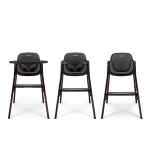 Three nuna bryn highchairs with dark gray fabric seats and sleek wooden legs shown from the front