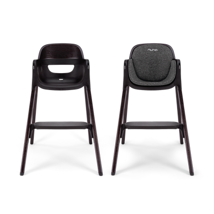 Nuna BRYN highchair metro with black textured fabric seat and dark wooden legs for modern dining seating