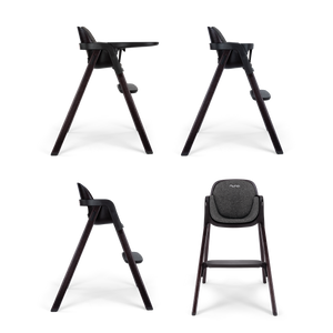 Modern black nuna BRYN highchair with sleek wooden legs and textured gray fabric seat for stylish feeding