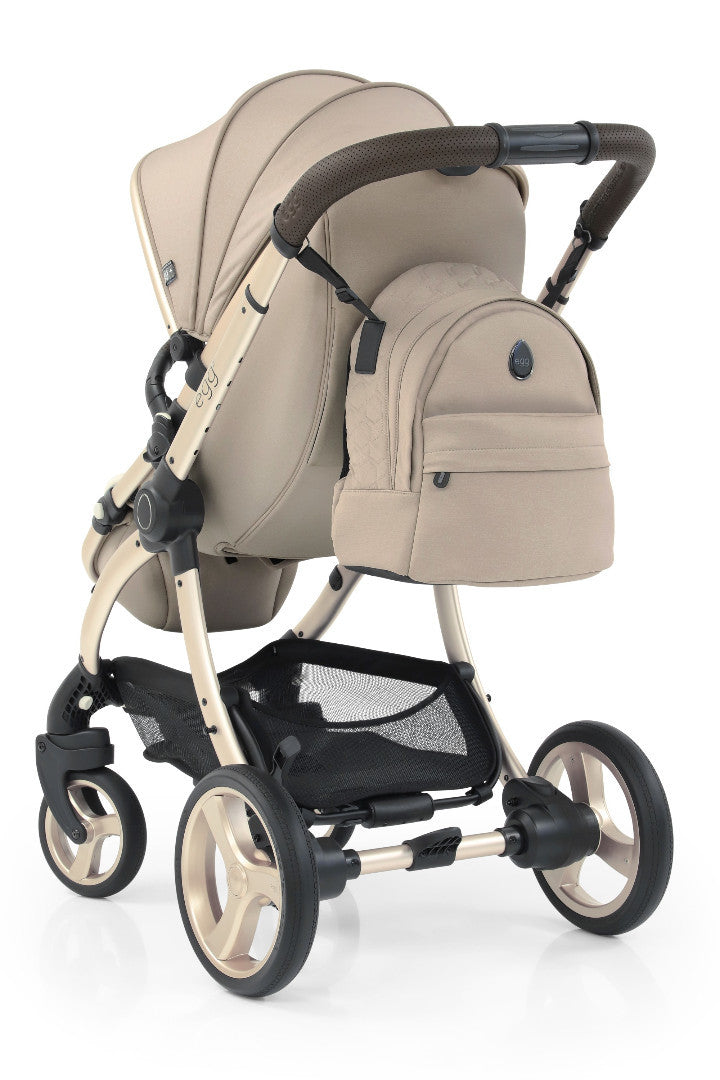 Beige and black egg3 feather stroller with matching backpack attached to handlebar in all stages 360 bundle
