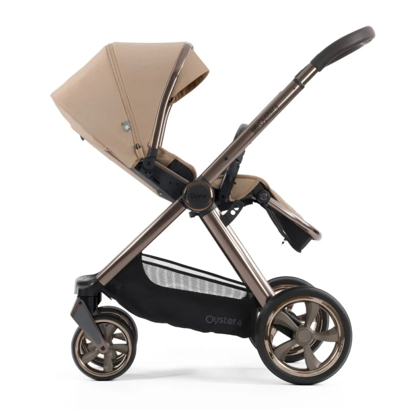 Beige and bronze oyster 4 fawn essentials stroller with sleek design and black accents on wheels and storage basket