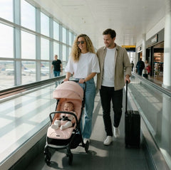 My babiie mbx2 compact stroller blush pink with black frame and handlebars for easy urban mobility