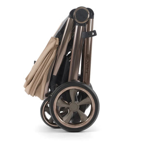 Oyster 4 fawn essentials travel system folding stroller with rose gold frame black wheels and beige fabric canopy