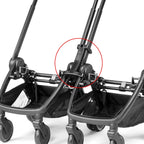 Black plastic stroller handle connector with integrated locking mechanism on the back of peg perego city loop twin 3 in 1 travel system