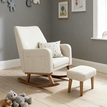 Cream-colored upholstered babymore callie nursing chair and stool with wooden legs and matching ottoman in ivory