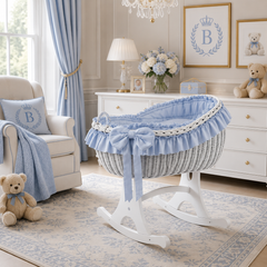MJ Marks Bianca White Wicker Rocking Crib with Blue Bedding
