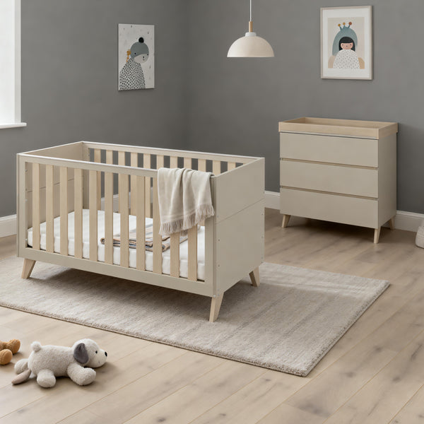 Beige wooden baby crib with slatted sides and angled legs in babymore dante 2 piece nursery room set cashmere
