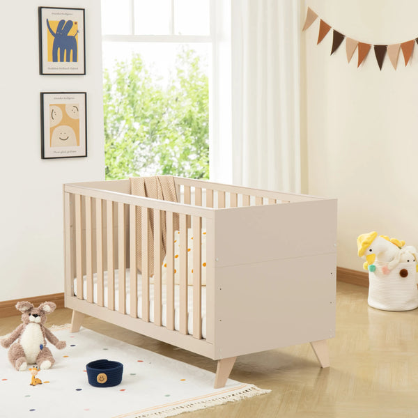 Beige wooden babymore dante crib with slatted sides and angled legs in cashmere nursery room set