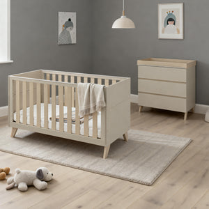 Beige wooden baby crib with slatted sides and angled legs from the Babymore Dante 2 piece nursery room set cashmere