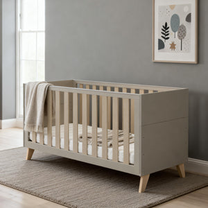 Modern gray wooden crib with light wood legs and vertical slats from babymore dante 2 piece nursery room set cashmere