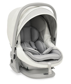 A sleek modern bebécar stylo class privé white sparkle 3-in-1 travel system infant car seat in beige and gray with plush cushioning