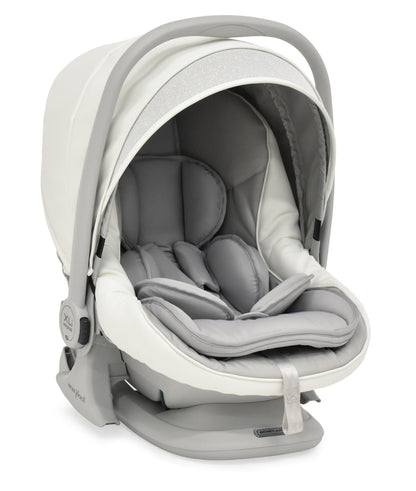 A sleek modern bebécar stylo class privé white sparkle 3-in-1 travel system infant car seat in beige and gray with plush cushioning