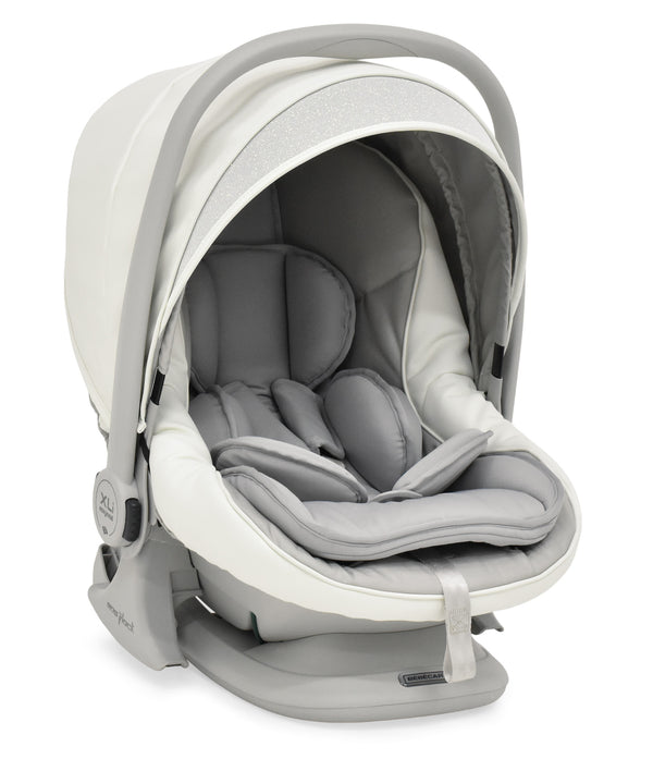 A sleek modern bebécar stylo class privé white sparkle 3-in-1 travel system infant car seat in beige and gray with plush cushioning