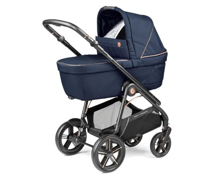 Navy blue peg perego veloce elite carrycot with black metal frame wheels and beige stitching for travel system bundle