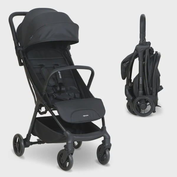 My babiie mbx2 compact stroller in black with foldable design and soft fabric canopy for easy travel and storage