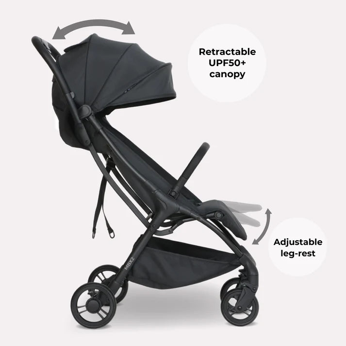 My Babiie MBX2 compact stroller in black with retractable UPF50+ canopy and adjustable leg-rest shown from the back