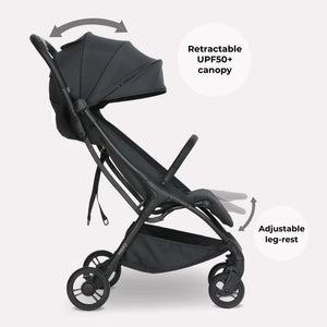My Babiie MBX2 compact stroller in black with retractable UPF50+ canopy and adjustable leg-rest shown from the back