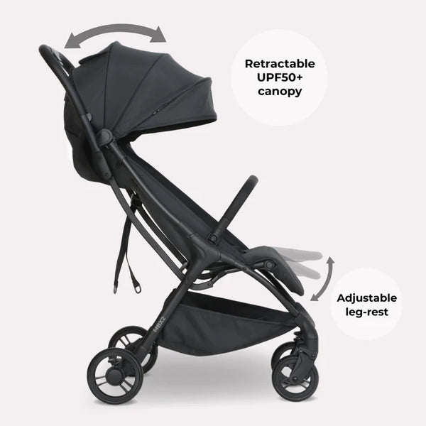My Babiie MBX2 compact stroller in black with retractable UPF50+ canopy and adjustable leg-rest shown from the back