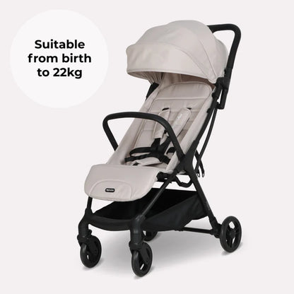 My Babiie MBX2 compact stroller in oatmeal with beige and black foldable design, canopy, padded seat, and four wheels