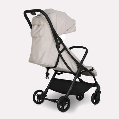 My Babiie MBX2 compact stroller in oatmeal beige and black features a sleek foldable design for easy travel