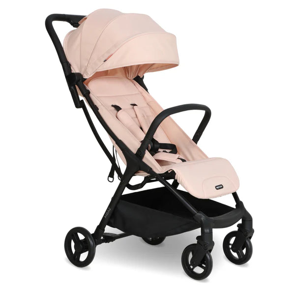 My babiie mbx2 compact stroller in blush pink with soft fabric canopy and seat on a sturdy black metal frame