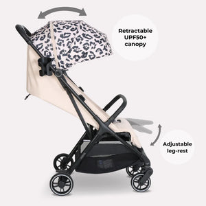 My Babiie MBX6 auto-fold compact stroller in beige and black with a leopard-print retractable canopy