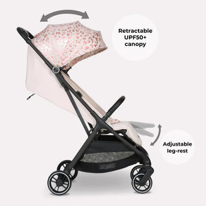 My Babiie MBX6 auto-fold compact stroller in pink leopard print with black frame and adjustable leg rest
