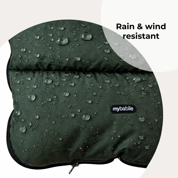 My babiie universal footmuff in dark green quilted fabric designed as a rain and wind resistant baby stroller cover
