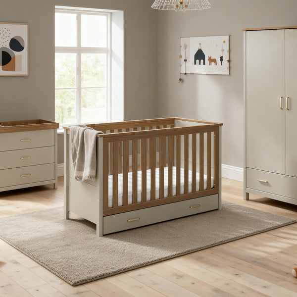 Light gray and natural wood finish babymore mira baby crib with built-in drawer in cashmere warm oak nursery set