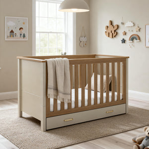Beige and light wood two-tone Babymore Mira cot bed with built-in drawer in cashmere warm oak finish