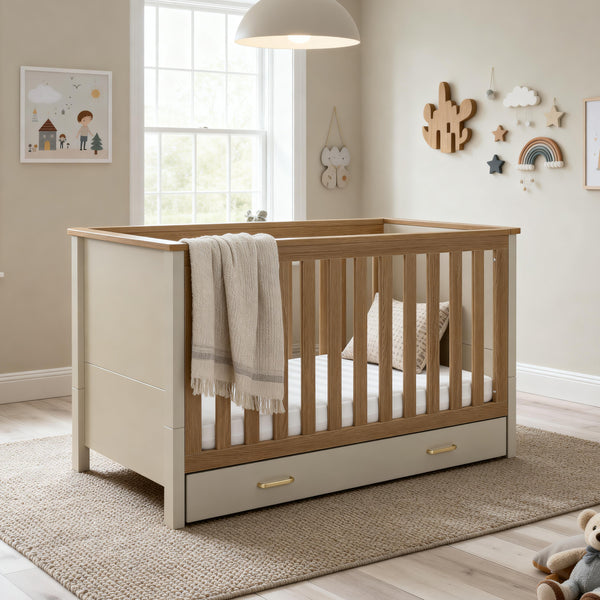 Beige and light wood two-tone Babymore Mira cot bed with built-in drawer in cashmere warm oak finish