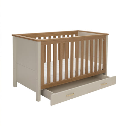 Babymore Mira cot bed in cashmere warm oak with beige oak finish and built-in drawer for storage