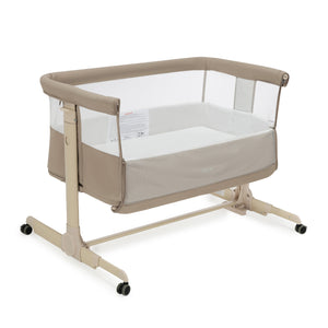 Babymore neera bedside crib khaki beige convertible bassinet with mesh sides padded fabric and metal frame on wheels