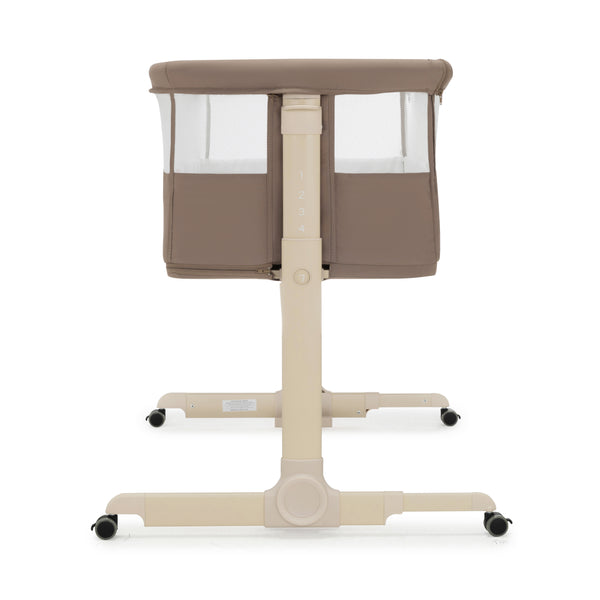 Beigm convertible Babymore Neera bedside crib with mesh sides and wheeled base in mocha color