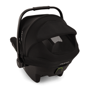 Black nuna pipa next infant carrier with sleek modern design and subtle lime green accents on caviar base