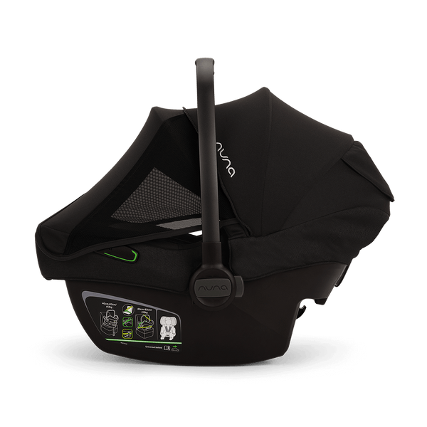 Black nuna pipa next infant carrier with mesh panel and green accent details for baby car safety and comfort